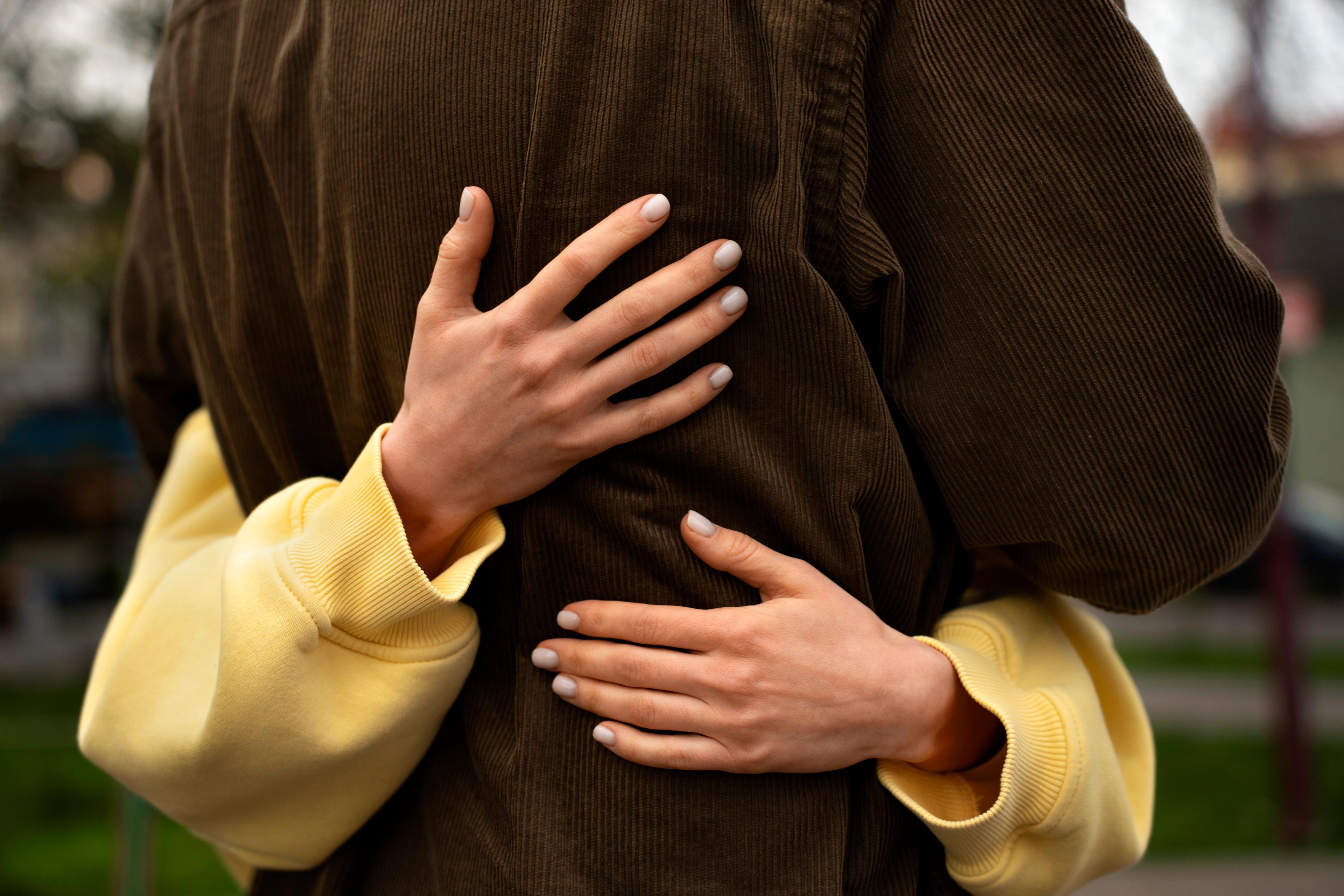A couple hugging each other, which is an essential part of the National Hugging Day, one of the most important relationship holidays.