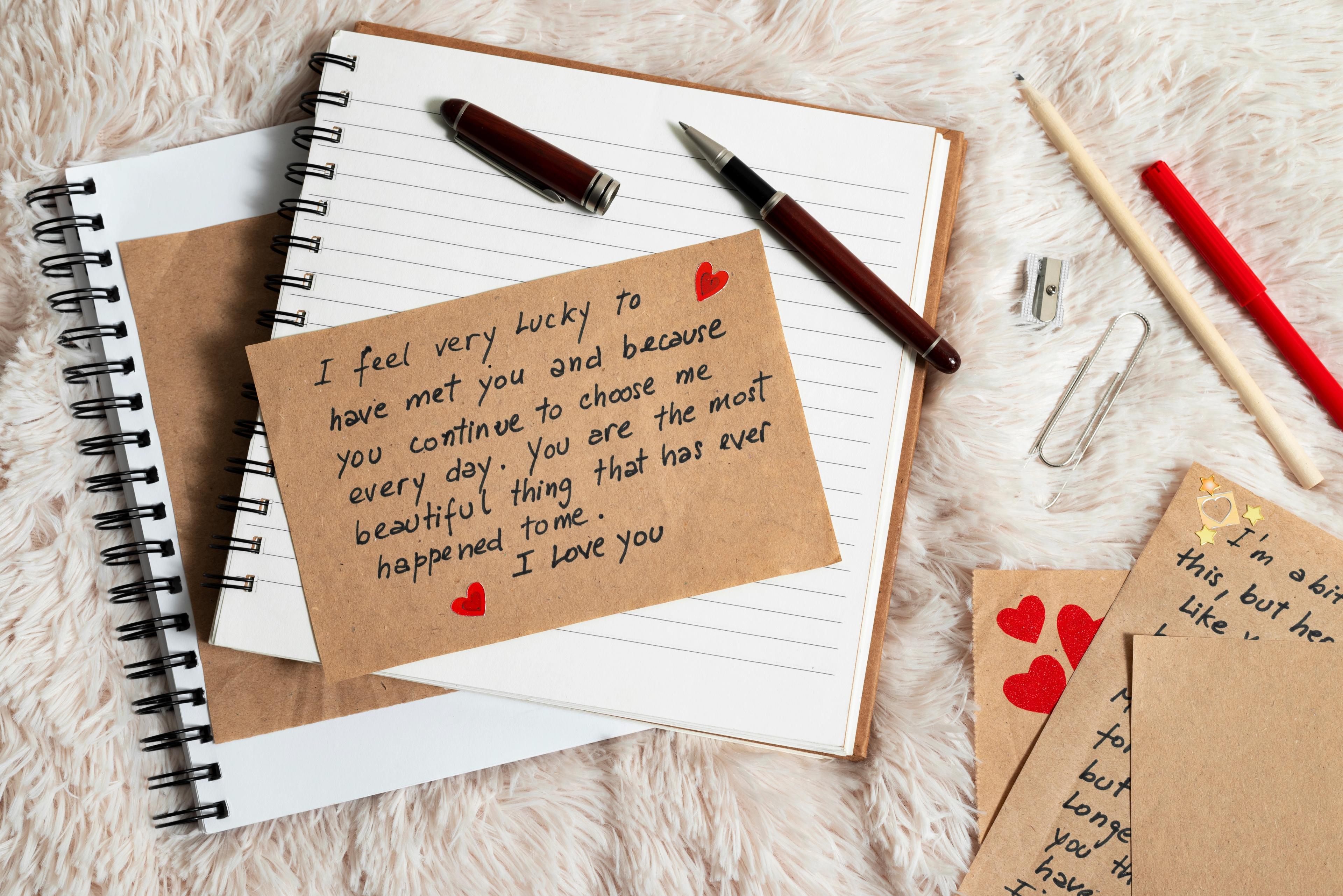 A love note on a blank notebook, representing the National Love Note Day, one of the most important relationship holidays.