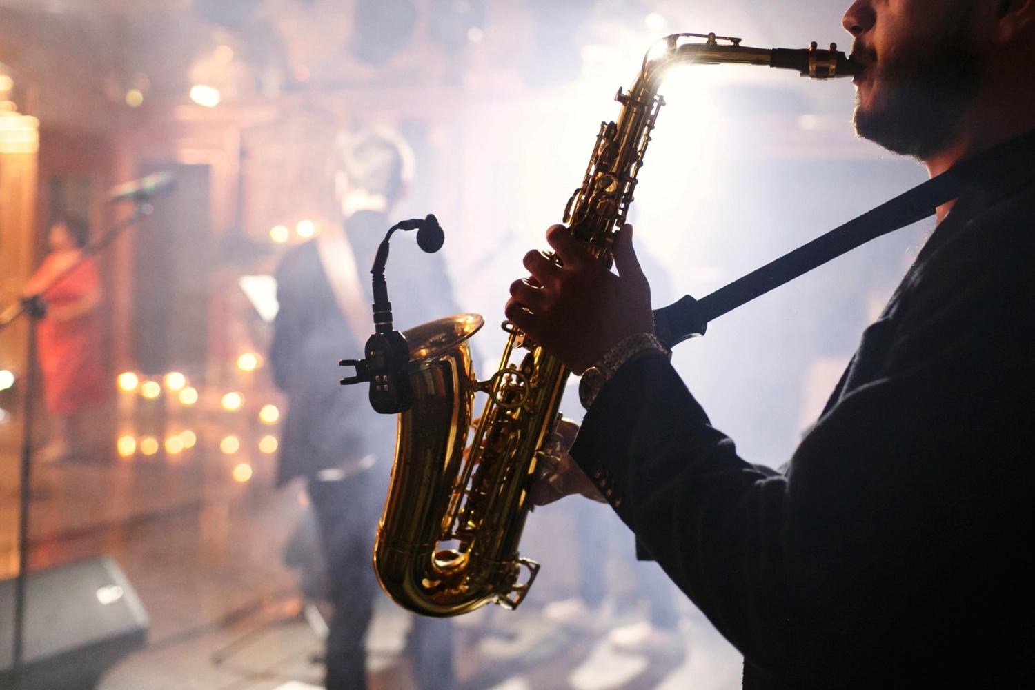 A man playing saxophone during a jazz night date, which is one of the best Valentine's Day date ideas for couples.